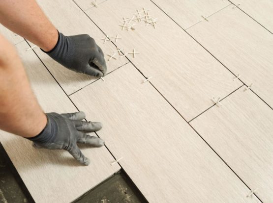 OzGood Tiler laying down wood based tiles